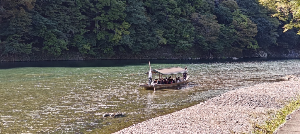 a boat on a river in Kyoto Japan