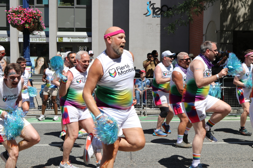 male cheer leaders marching in the 2025 Toronto Pride parade